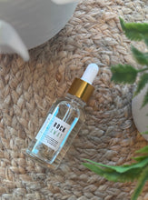 Load image into Gallery viewer, The Rock Away Car Diffuser Refill in a 50 ml glass bottle with dropper.
