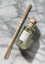 Load image into Gallery viewer, The Santal &amp; Rum Scent in a reed diffuser from the Classic Collection.

