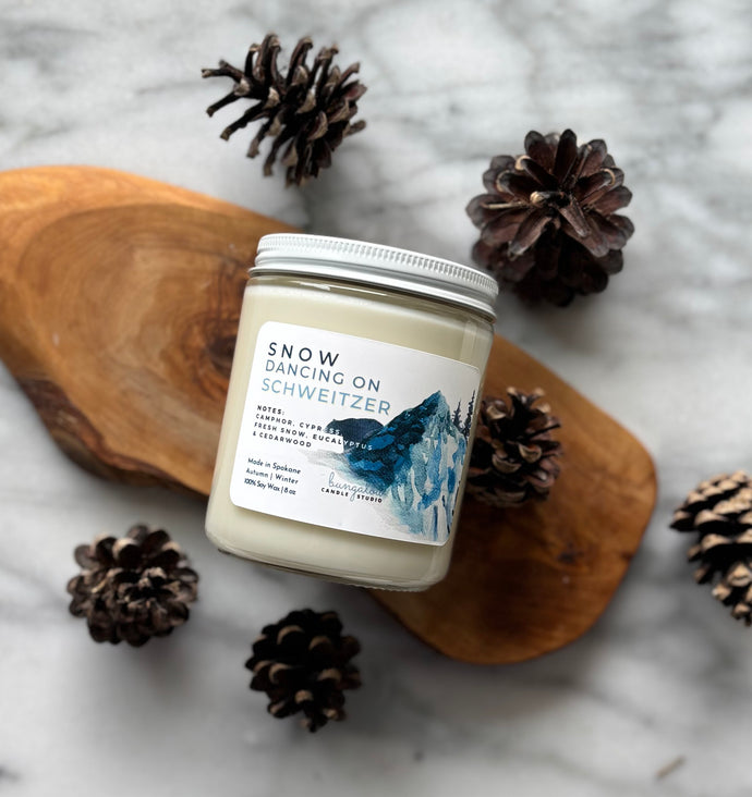 Snow Dancing on Schweitzer soy wax candle in 8oz size clear glass jar with white tin lid - Bungalow North Idaho Collection