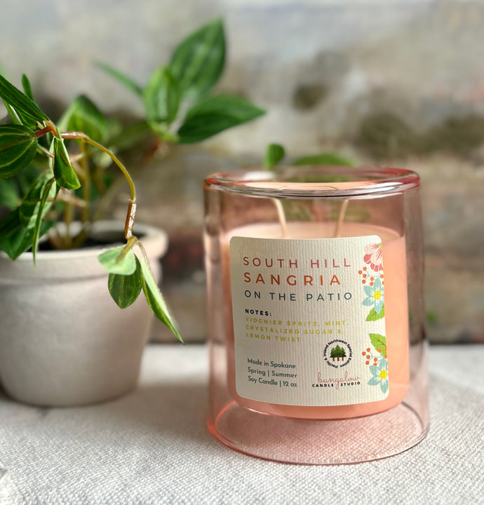 South Hill Sangria Candle from the Spring and Summer Collection shown in a single upright pink 12 ounce double glass jar.