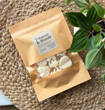 Load image into Gallery viewer, A package of soy wax melts from our Cascade Collection in the Tobacco &amp; Woods scent.
