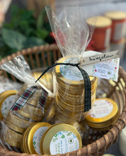 Load image into Gallery viewer, Sets of travel tin candles with holiday and winter scents grouped together in a basket
