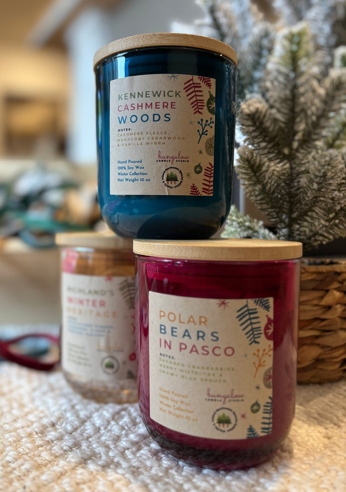 10 oz colored holiday jar candles in the Fall and Winter Tri-Cities Collection, stacked together.