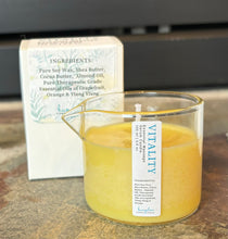 Load image into Gallery viewer, Massage serum candle in a beaker shaped jar in the scent of Vitality.
