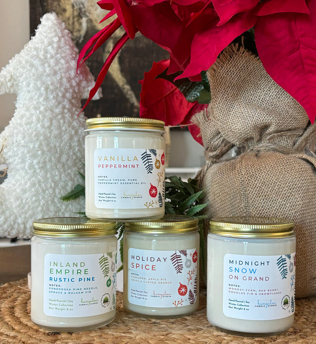 Classic winter and holiday scented candles grouped together.