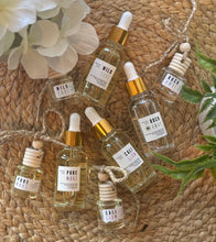 Load image into Gallery viewer, Group of car diffusers and refill bottles in the Coastal Collection scents
