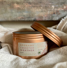 Load image into Gallery viewer, One Spokane Sweater Weather Travel Tin Candle shown close up
