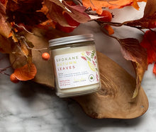 Load image into Gallery viewer, The Spokane Autumn Leaves candle scent from Bungalow&#39;s Fall Collection is shown in the 8 oz glass jar with a white lid.
