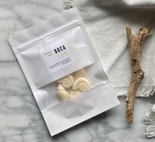 Load image into Gallery viewer, Sea shell shaped wax melts from the Coastal Collection in a resealable package. Boca Sun scent shown. 
