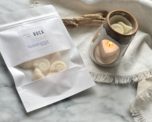 Load image into Gallery viewer, Sea shell shaped wax melts from the Coastal Collection in a resealable package. Boca Sun scent shown. 
