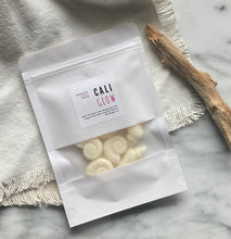 Load image into Gallery viewer, Sea shell shaped wax melts from the Coastal Collection in a resealable package. Cali Glow scent shown. 

