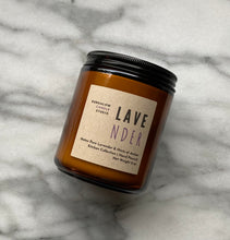 Load image into Gallery viewer, The Lavender candle scent from the Kitchen Collection, shown in 8 oz sized amber-colored glass jar.
