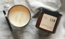 Load image into Gallery viewer, The Lemon candle scent from the Kitchen Collection, shown in large 16 oz sized amber-colored glass jar with 3 wicks.
