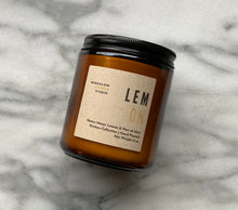 Load image into Gallery viewer, The Lemon candle scent from the Kitchen Collection, shown in 8 oz sized amber-colored glass jar.
