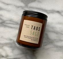 Load image into Gallery viewer, The Taos Sage candle scent from the Kitchen Collection, shown in 8 oz sized amber-colored glass jar.

