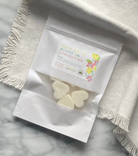 Load image into Gallery viewer, Heart-shaped Soy Wax Melts from the Bungalow Spring and Summer Collection in a white sealed package with a window in the High Drive Bluff in Springtime scent.
