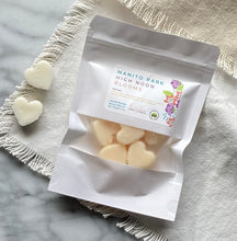 Load image into Gallery viewer, Heart-shaped Soy Wax Melts from the Bungalow Spring and Summer Collection in a white sealed package with a window in the Manito Park High Noon Blooms scent.
