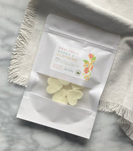 Load image into Gallery viewer, Heart-shaped Soy Wax Melts from the Bungalow Spring and Summer Collection in a white sealed package with a window in the Post Falls Barns and Blossoms scent.
