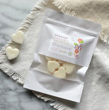 Load image into Gallery viewer, Heart-shaped Soy Wax Melts from the Bungalow Spring and Summer Collection in a white sealed package with a window in the Spokane Valley Solstice scent.
