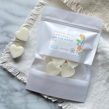 Load image into Gallery viewer, Soy Wax Melts in the shape of hearts and in a white sealed package with a window.
